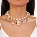Detail of bohemian shell and starfish pendant necklace with imitation pearls on model - Gold Artificial Pearl Shell Holiday Style Necklace (29132-G)