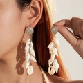 Detailed view of beach-style silver seashell earrings with conch tassels on a model - Silver Scallop Dangle Shell Style (29316-white)