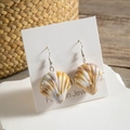 Detailed view of striped resin shell drop earrings on a display card with ocean style - Brown And White Striped Shell Style (29374-3)