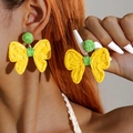 Detail of handmade woven raffia bow earrings in yellow and green bohemian style - Yellow & Green Bow (29473-yellow)