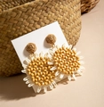 Close-up of bohemian leaf-shaped raffia earrings featuring yellow beads and woven texture - White Yellow Brown Sunflower (29360-ear-yellow-EP)