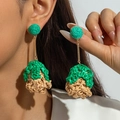 Detail of leaf-shaped raffia earrings showing green handwoven texture and drop design - Green & Beige Patchwork Dangle (31712-ear-brown-EP)