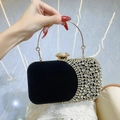 Elegant black velvet evening clutch with rhinestone accents and gold ring handle - Black