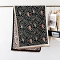Detail of elegant black paisley scarf with soft tassels and intricate pink patterns - 186cmx66cm / Black