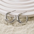 Detailed view of polished silver C-shaped hoop earrings on minimalist geometric props - Thickened Mirror Polished C-Shape Earrings (28578-8-silver)