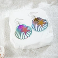 Macro detail of colorful gradient starfish and seashell earrings on sand - Iridescent Starfish Shell (29227-7)