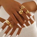 Close-up of five irregular gold geometric rings set with stacked styling on model hand - Gold Irregular Geometric 5-Piece Set (29451-G)