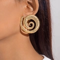 Close-up of chunky gold spiral geometric earrings with detailed ribbed texture on model - Gold Large Spiral Texture Style (29090-G)