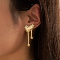 Close-up of golden geometric melted heart stud earrings worn on a female ear - 29082-g