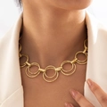 Layered gold chain link necklace with chunky interlocking rings on female model - Hammered Interlocking Round Style (28487-gold) / Gold