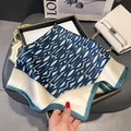 Silk square scarf with geometric alphabet print and dark green edges on a tray - Square Style / Blue Patchwork (With Heart Buckle)