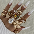 Baroque gold heart and pearl ring set with floral geometric designs on model hand - 11-Piece Gold Baroque Pearl Heart Flower Ring Set (30412)