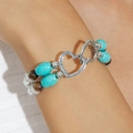 Detail of bohemian beaded bracelet featuring turquoise stones and interlocking metal hearts - Double Layer Beaded Bracelet (30379-bra-whi)