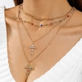 Macro view of layered gold cross necklaces with colorful zircon stones and vintage details - Bohemian Colorful Gemstone 4-Layer (30737-nek-G)