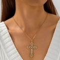 Detail of vintage gold hollow cross pendant necklace with zircon on a female model - Vintage Relief Fine Ring Necklace (30739-nek-G-4)