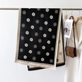 Detail of camellia flower pattern and dot borders on a black and white winter scarf - Black