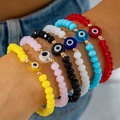 Close-up of seven colorful beaded evil eye stretch bracelets worn on a female wrist - 7Pcs Set (30880-bra-cor-EP)