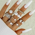 7pcs silver ring set with white pearls in various geometric minimalist styles on hands - 7-Piece Silver Artificial Pearl Set (30520-ring-S)