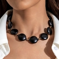 Close-up of matte black beads and gold metal links of the statement choker necklace - Black Flat Round Style