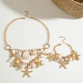 Detail of beach jewelry set featuring gold shell and starfish charms with pearls - Gold Ocean Style Necklace Bracelet Set (29329-suit-G)