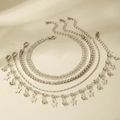 Detail van vierdelige zilveren enkelbandjesset met vlinderbedeltjes en kristallen tennisarmband - Vlinder Strass Zilveren Set (30953-ank-S-EP)