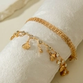 Detail of gold-layered shell anklet set with sparkling zircon on soft white display - Gold Shell Leaf Set (31105-ank-G-2-EP)