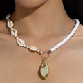 Bohemian seashell necklace with a polished gold conch pendant and white pearl beads - Asymmetric Gold Conch Shell Beaded Necklace (31420-nek-G-EP)