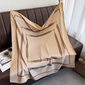 Close-up of silk square scarf with geometric patterns and golden chain details on leather - 90*90cm / Light Khaki
