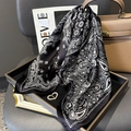 Detail of paisley print silk scarf draped over a black tray and stylish handbag - 65*65cm / Black Paisley(ZC-288)