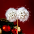 Detailed view of white pompom snowflake earrings over a festive red and green background - Snowflake Pom Pom Style / White Snowflake (31180)