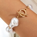 Close-up of baroque irregular pearl necklace featuring a gold OT toggle clasp detail - Irregular Baroque Pearl Bracelet (30567-bra-white)