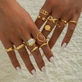 Irregular pearl and gold geometric ring set shown on hand with vintage minimalist aesthetic - 10-Piece Gold Artificial Pearl Geometric Set (29459-G)