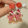 Détail de boucles d'oreilles bonhomme de pain d'épices à paillettes rouges et dorées de Noël - Bonhomme de pain d'épices pailleté orange et or