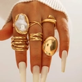 Golden irregular pearl ring set with geometric vintage metal designs worn by a model - 6-Piece Gold Large Artificial Pearl Statement Set (30485-ring-G)