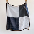 Polka dot silk square scarf with orange trim shown in a stylish folded drape - 70*70cm / Polka Dot Black (SW-9)