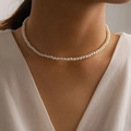 Elegant white bead choker necklace on model featuring glossy round pearls - Creamy White Pearl Choker