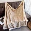Detail of elegant beige silk square scarf with brown geometric patterns on a leather sofa - 90*90cm / Khaki Coffee Edge (XW-181)