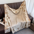 Elegant floral twill silk square scarf displayed with fashion accessories on a leather sofa - Khaki (XW-175)