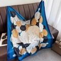 Detailed view of large vintage rose print silk scarf on a stylish leather surface - 90x90cm / Blue