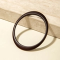 Detailed view of dark brown acrylic bangle with smooth wood grain texture on display - Asymmetrical Art Style (31201) / Dark Brown