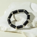 Detail of matte black threaded beads and polished silver beads on a minimalist elastic bracelet - Frosted Irregular Threaded Black Silver (31228-bra-black-EP)