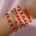 Conjunto de cinco pulseras de cuentas rojas y doradas con dije de corazón en la muñeca - Rojo y Dorado (29268-red)