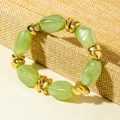 Detail of light green translucent beaded bracelet with polished gold metal spacers - Light Green Irregular Bead Bracelet (31597)
