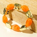 Detail of orange marble resin beads and lava style gold metal blocks on elastic bracelet - Orange Marble Pattern Resin Bead Bracelet (31598)