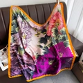 Retro square floral silk scarf with orange borders draped over a brown leather sofa - DM-18-Yellow Border