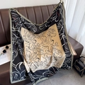 Macro shot of large square floral print scarf with elegant tulip pattern and contrast border - Black Khaki