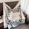 Detail of elegant black and white silk scarf with gold chain and camellia flower patterns - White