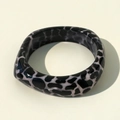 Close-up of wide resin bangle featuring black and white leopard print and glossy finish - Black White Leopard Wide Bangle Style (31636-bra-bw)