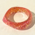 Detail of colorful glitter resin bracelet with pink and orange gradient and sparkles - Rose Pink