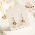 Detail of marble pattern resin earrings on jewelry card with a beach shell background - Brown White Marble Rhombus Style (29368-9)